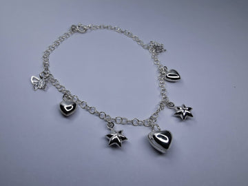 Pulsera con Corazón Estrella y Cascabeles de Plata .925